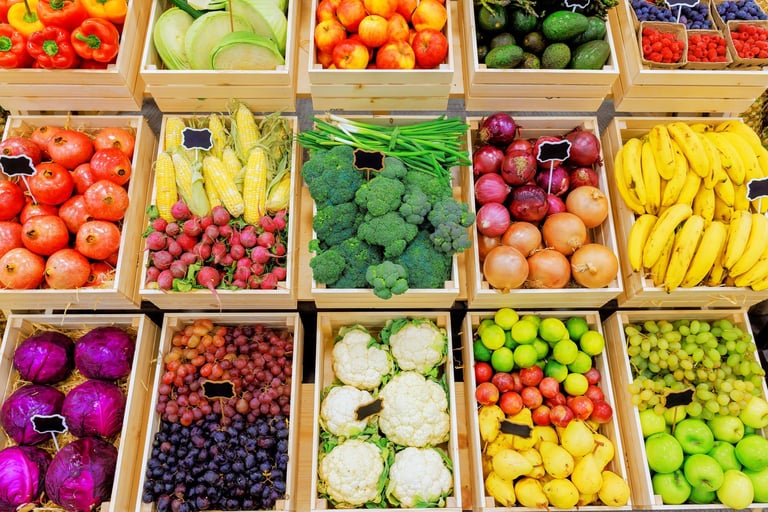 Baskets filled with various fruits and vegetables displaying vibrant colors at a bustling farmers market