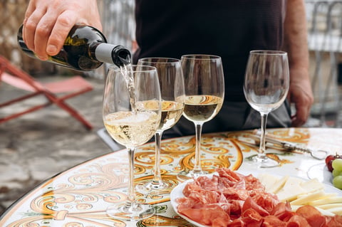 Wine tasting with friends toasting in a relaxed winery setting