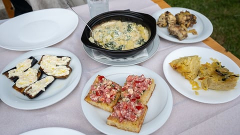 A diverse spread of authentic regional dishes adorning a rustic dining table
